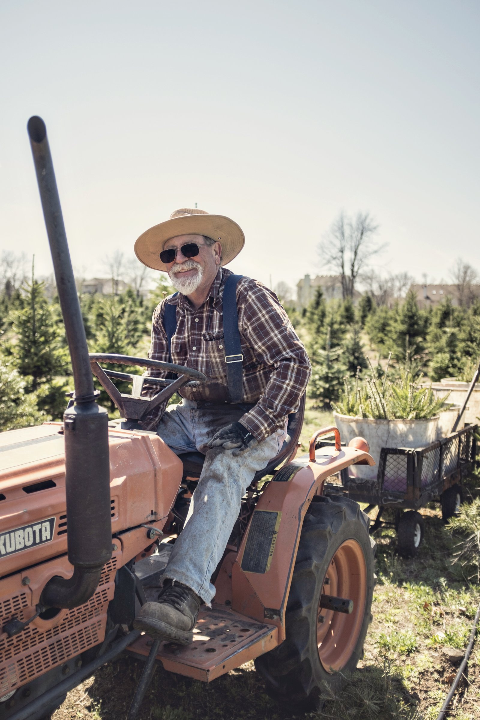Frank Genovese is pictured on his tractor in this family photo. Devoted to being a good steward of the farm, Frank left his job to tend to the land and earned community recognition for the farm's ecological stewardship. (Family photo)