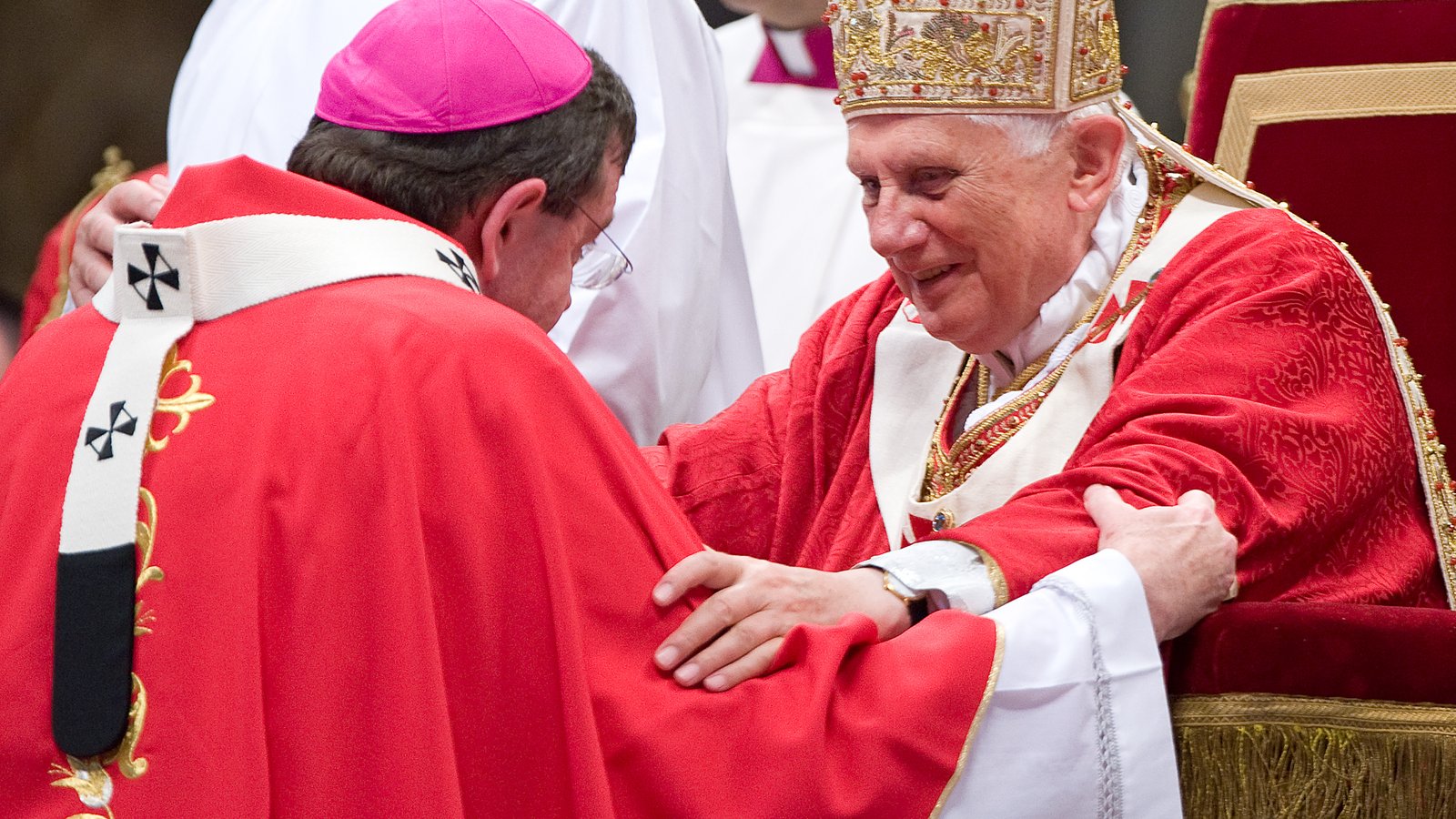Pope Benedict XVI smiles as he says a word of encouragement to Archbishop Vigneron after bestowing upon him the pallium, a woolen band denoting his role as a shepherd, on June 29, 2009, at St. Peter's Basilica in Rome. (L'Osservatore Romano | CNS photo)