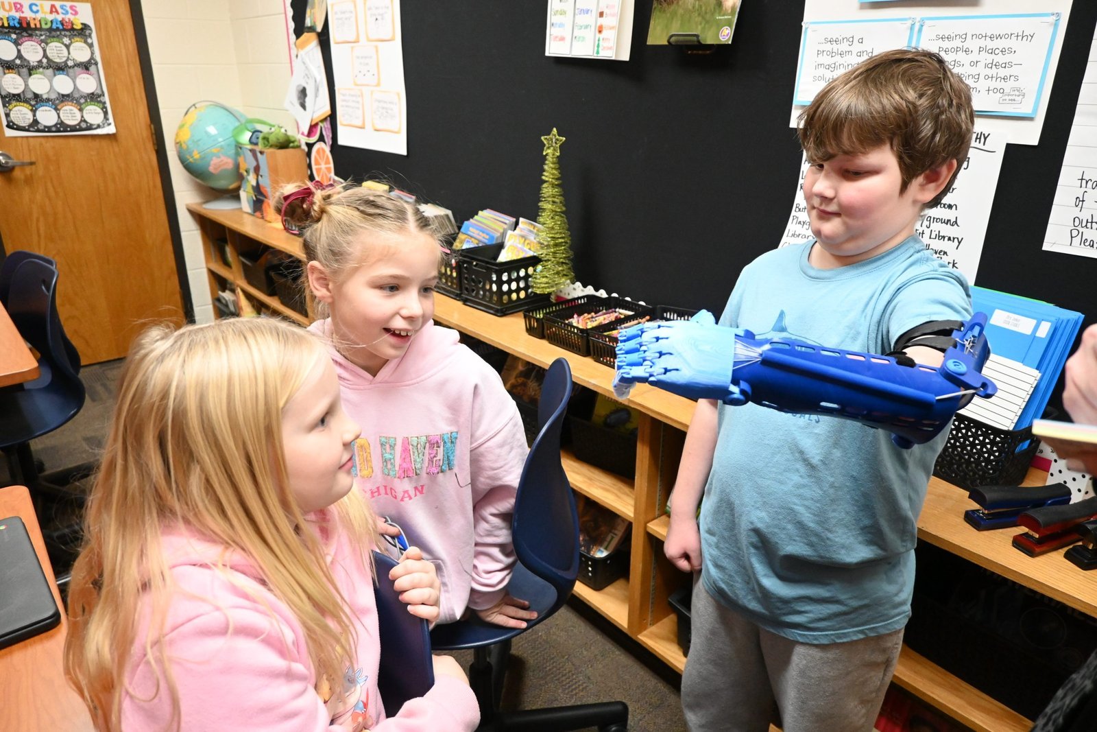 Due to a congenital birth defect, Kaysen was born without his left arm below his elbow. The Austin Catholic students and Kaysen were brought together through e-NABLE, a program with certified chapters around the world that create low-cost, 3D-printed prosthetic upper limb devices for those in need.