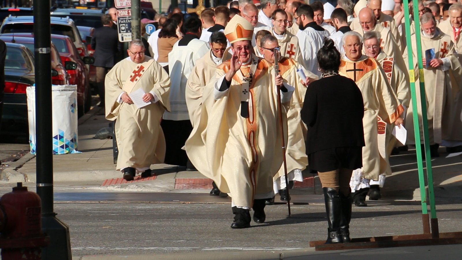 Archbishop Vigneron leads a joyful procession from St. Aloysius Parish in downtown Detroit to the Westin Book Cadillac hotel for the opening of Synod 16 on Nov. 18, 2016. The Holy Spirit's movement during the three-day gathering has been the genesis and driving force of the Archdiocese of Detroit's missionary transformation, the archbishop said.