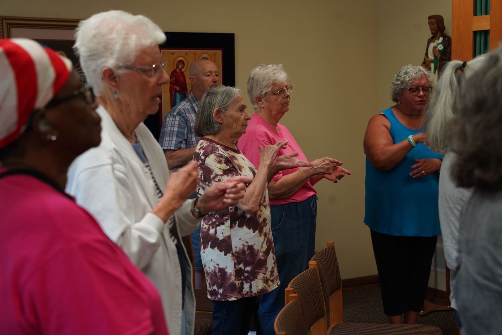 The congregation signs the Our Father during Mass at the St. John's Deaf Center Chapel in Eastpointe.