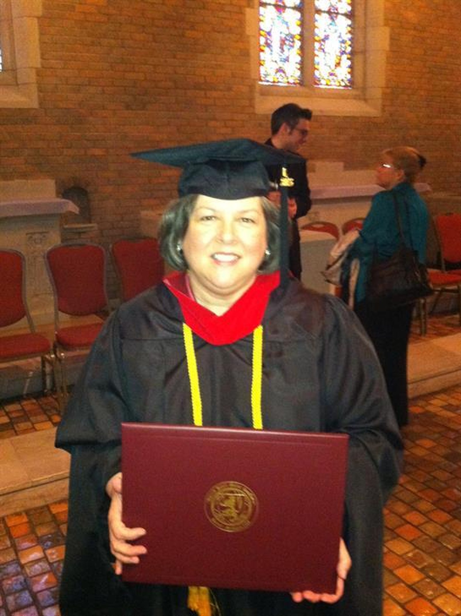 Maureen Blair earned a Master of Arts in Pastoral Studies in 2013 at Sacred Heart Major Seminary. During her time at the seminary, she agreed to lend the technicolor coat she made in 2008 for the seminarians’ production of “Joseph” in 2012. (Photo courtesy Gary Blair)