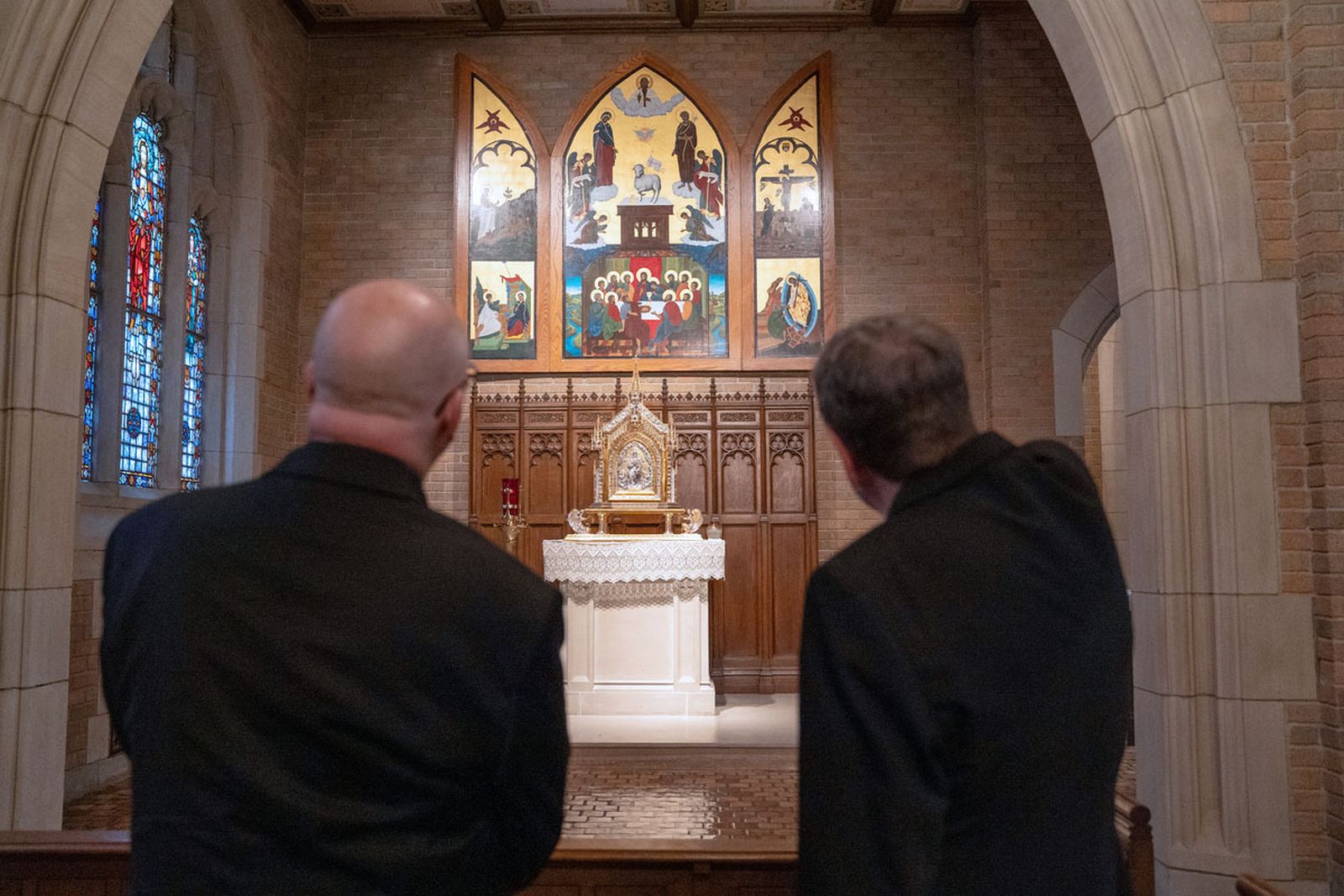 Archbishop-designate Weisenburger, left, and retiring Detroit Archbishop Allen H. Vigneron spend a few moments in prayer and reflection before the Blessed Sacrament in Sacred Heart Major Seminary's chapel before a press conference introducing Archbishop-designate Weisenburger on Feb. 11.