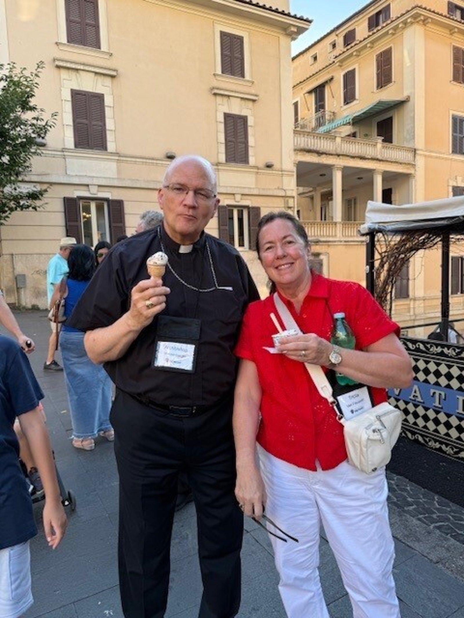 Archbishop Weisenburger enjoys gelato with Tricia Van Faussian.