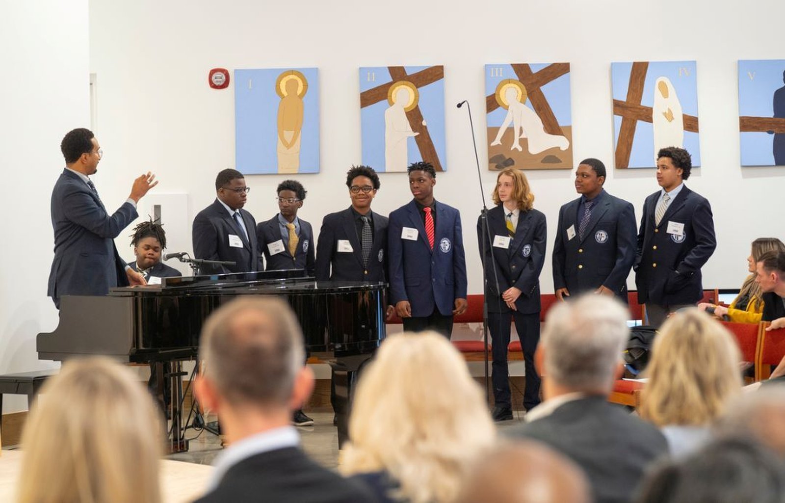 The Loyola High School pep musical group sings during the chapel blessing.