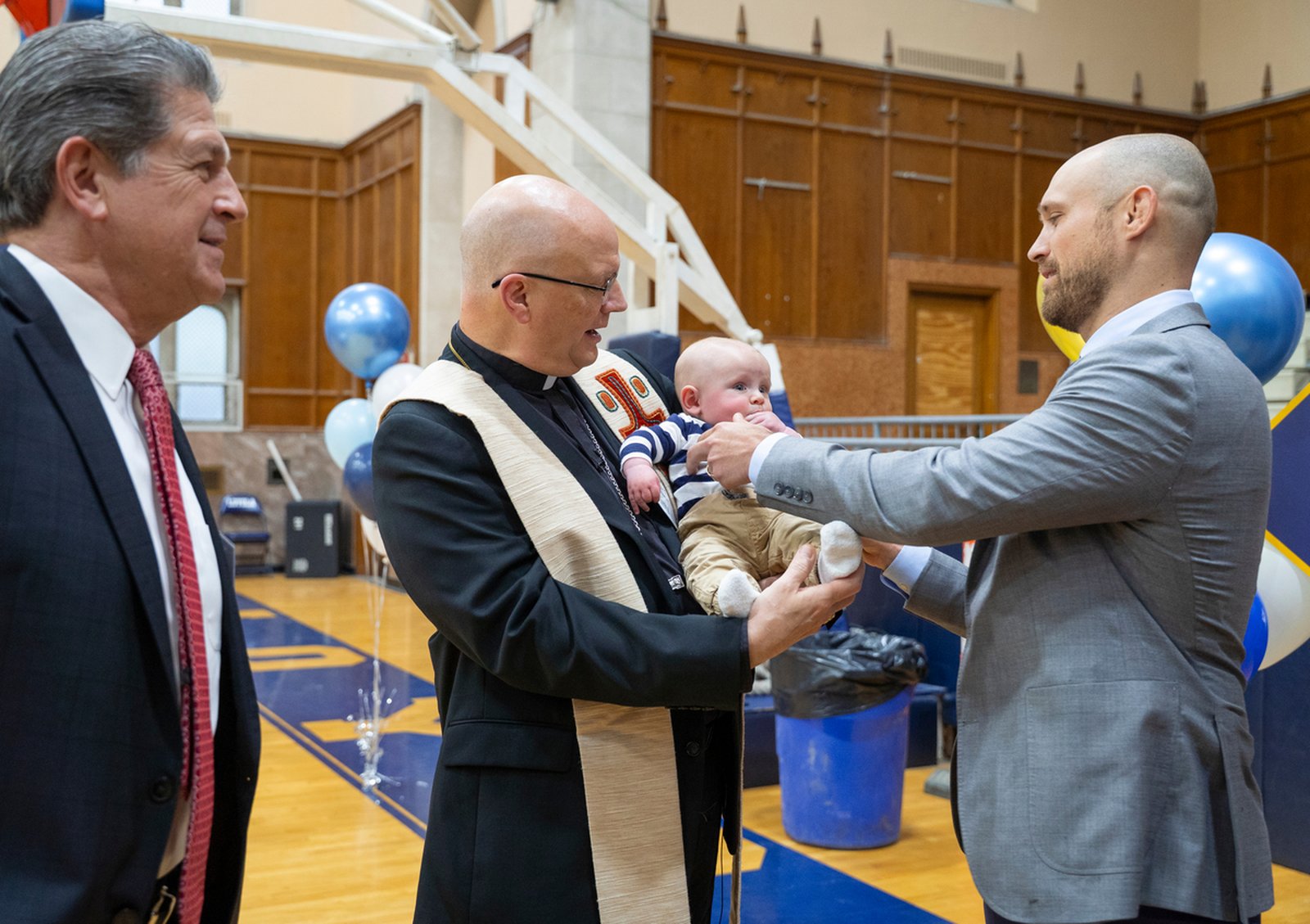 Archbishop Weisenburger greets school representatives and benefactors who supported the "Empower Loyola" campaign before the chapel blessing April 2.