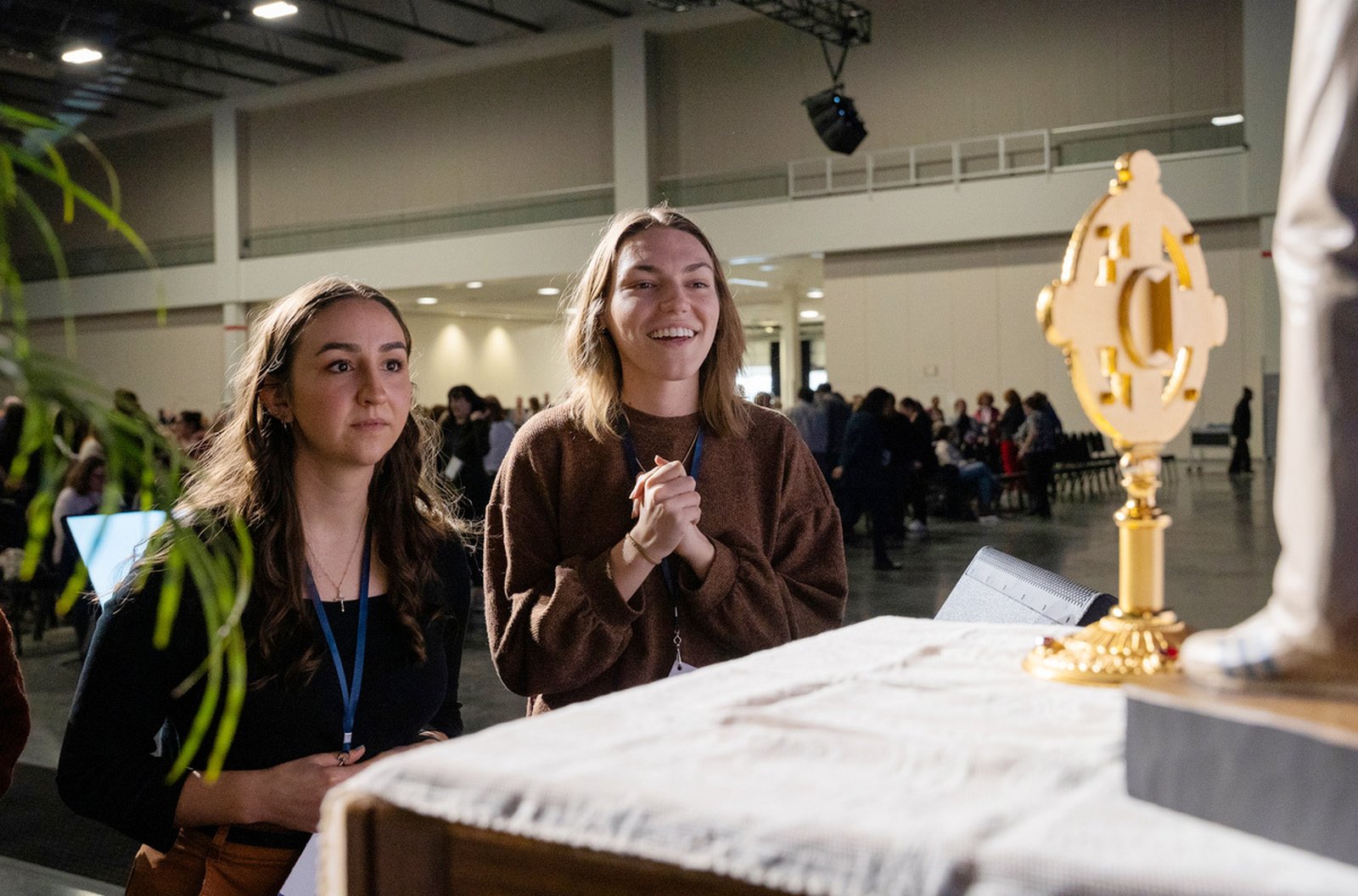 Teachers venerate a relic of Blessed Carlo Acutis, who will be canonized on April 27 as the Catholic Church's first millennial saint, during the F.I.R.E. conference.