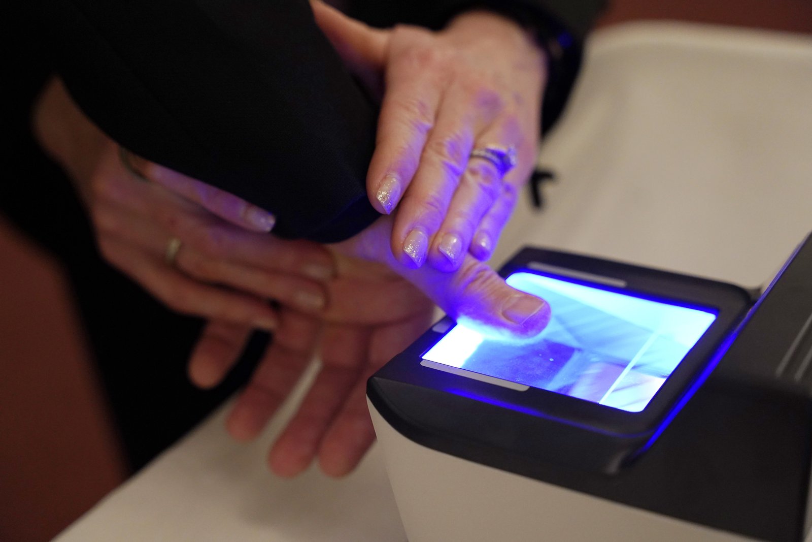 While the Archdiocese of Detroit already utilizes background checks for all clergy, employees and volunteers, fingerprinting is widely recognized as the "gold standard" for security, providing both a pre-screening measure and an ongoing safety check, Archbishop Weisenburger said. The archbishop was first in line to be fingerprinted as the initiative began in January, followed by Fr. Timothy Birney, the archdiocese’s vicar general and moderator of the curia, and Fr. John Maksym, the archdiocese's episcopal vicar for clergy discipline. (Photo by Izzy Cortese | Detroit Catholic)