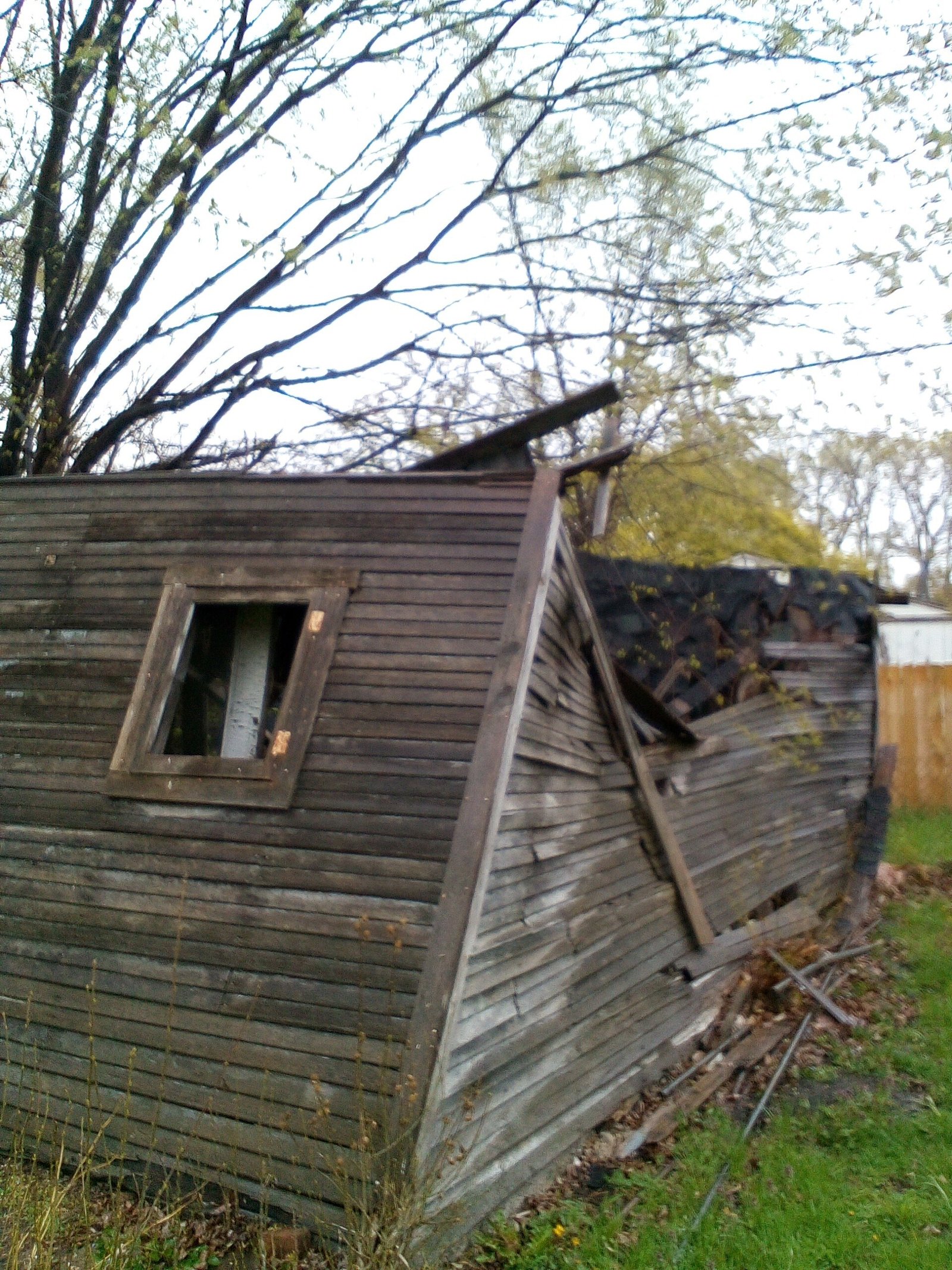 After a tree fell on a garage of a neighbor's house, Firm Foundations of Hope helped the resident tear it down and haul the damaged wood away. (Courtesy of Genevieve Kocourek)