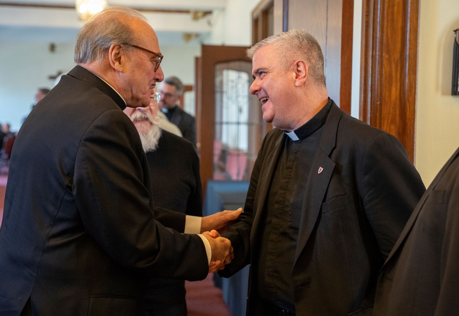 Fr. Creagh, right, speaks with Fr. Duane Novelly of St. Matthew Parish in Detroit during a meet-and-greet at Sacred Heart Major Seminary in Detroit on April 9. (Valaurian Waller | Detroit Catholic)