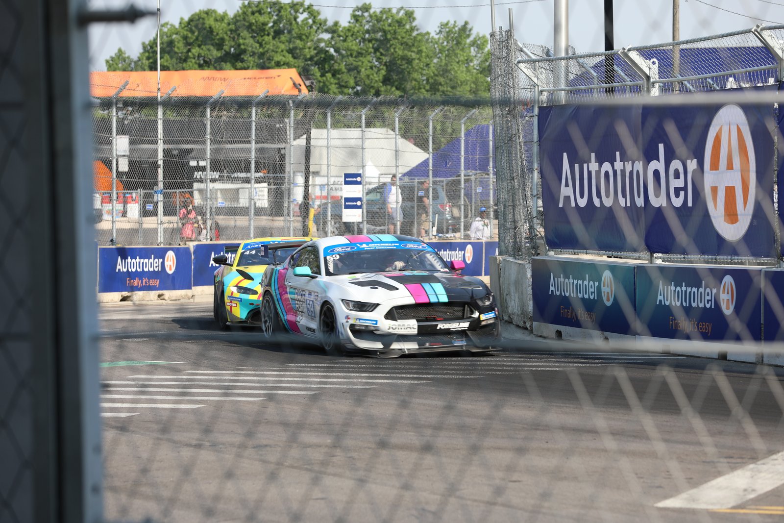 Cars from the IMSA Michelin Pilot Challenge Race, a support race of the NTT Indy Car Series, navigate Turn 2 of the Detroit street circuit. The race course runs right next to SS. Peter and Paul (Jesuit) church, and the roar of engines could be heard during Mass.