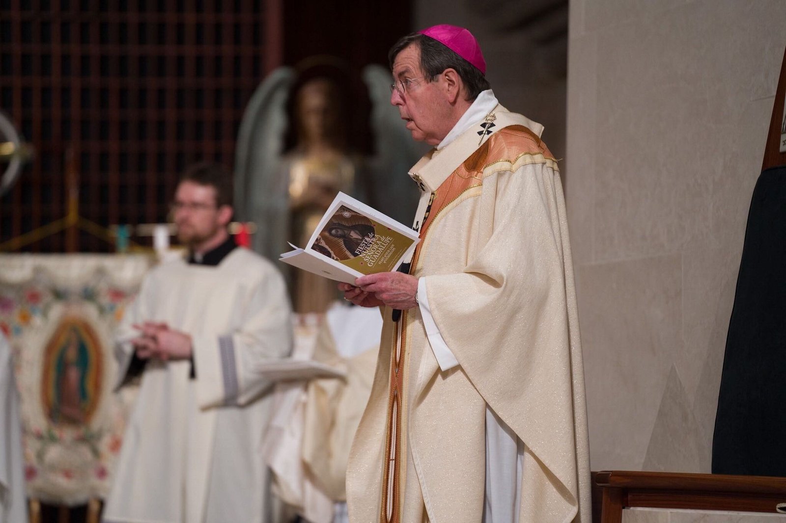 Archbishop Allen H. Vigneron prays during a Mass to celebrate Our Lady of Guadalupe at the Cathedral of the Most Blessed Sacrament on Dec. 9.