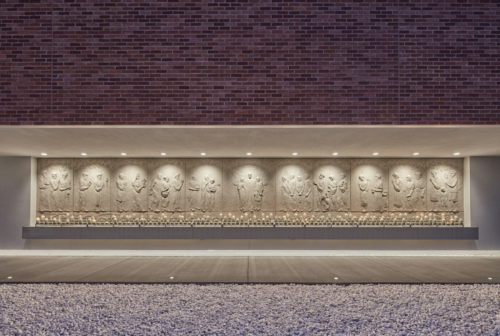 A relief sculpture installed at the Solanus Casey Center in Detroit, featuring Blessed Carlo Acutis alongside other saints who represent the diversity of the church.