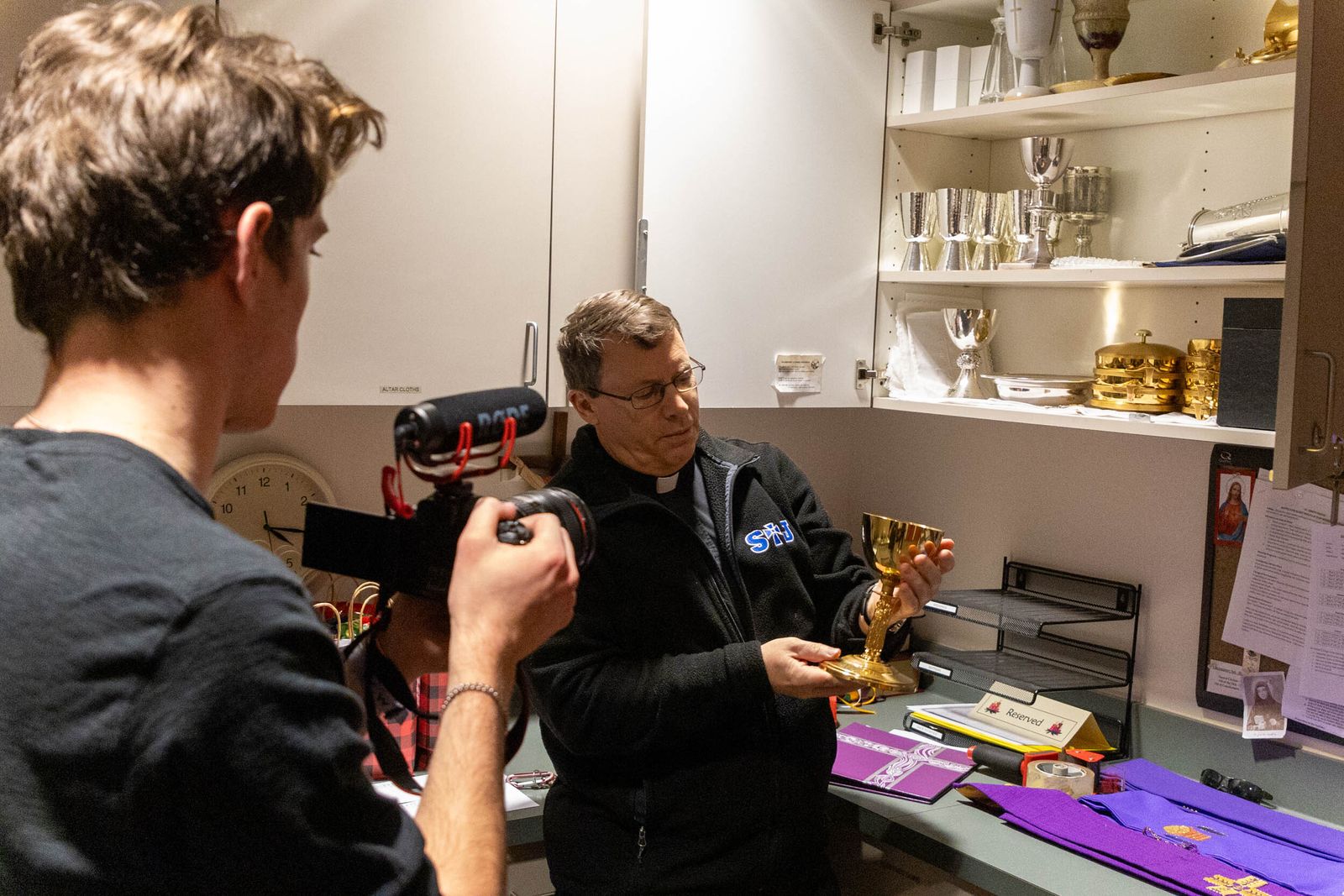 Fr. Kean shows the camera one the chalices used for Mass at St. Joseph the Worker Parish. In the film series, Sasak said he sought to highlight the threefold ministry of "priest, prophet and king," with another episode focused on Fr. Kean's vocation testimony.