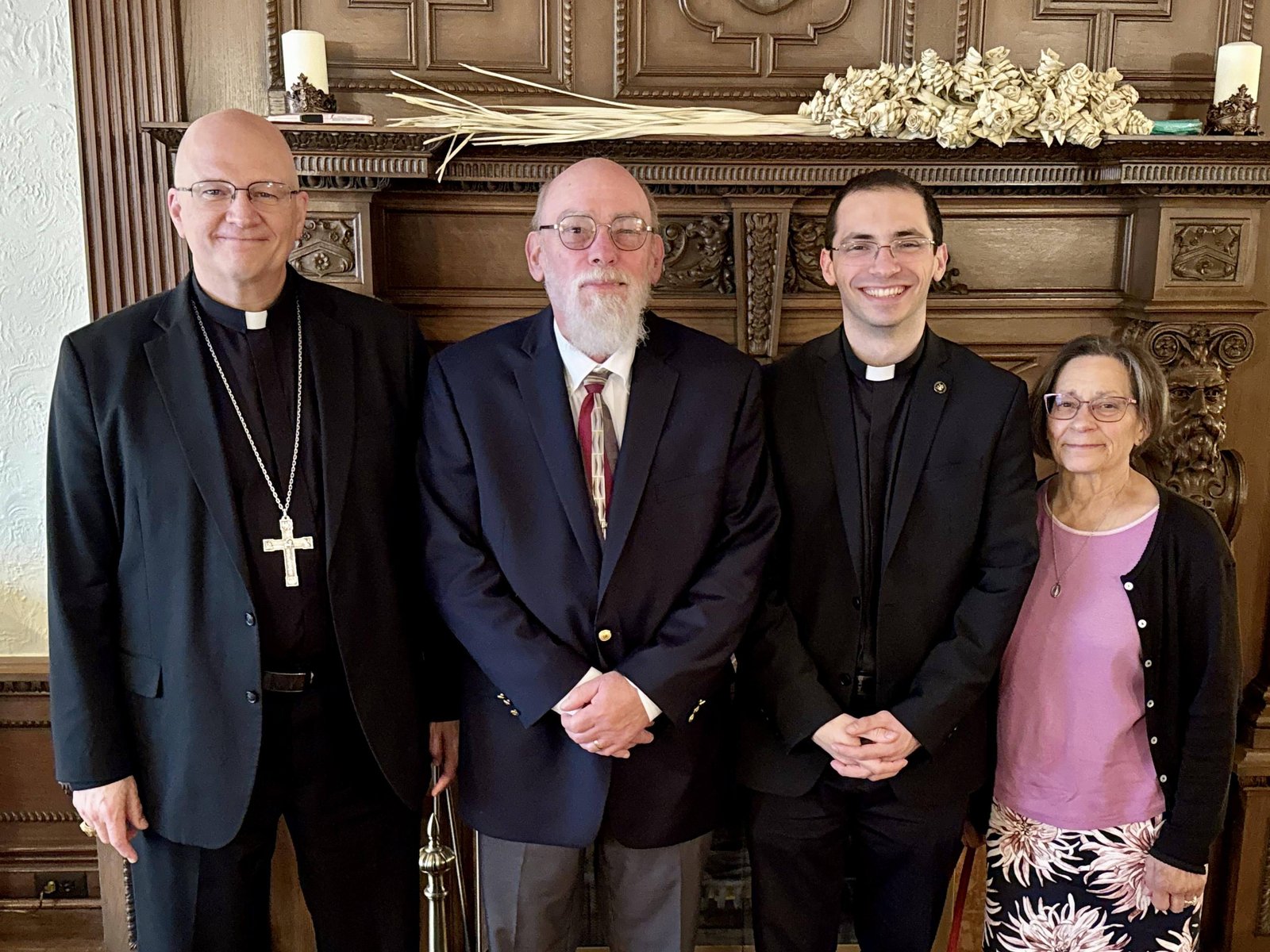 Archbishop Weisenburger with the future Fr. Benjamin Schroder and his parents, Randall and Karen, on the evening before Fr. Schroder's ordination.
