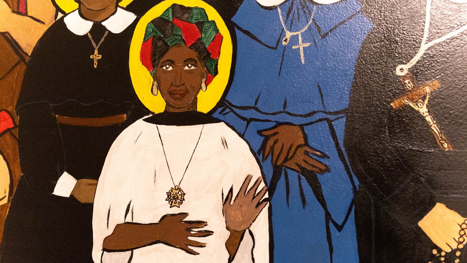 The individuals pictured on the mural represent the diversity of the southwest Detroit community.