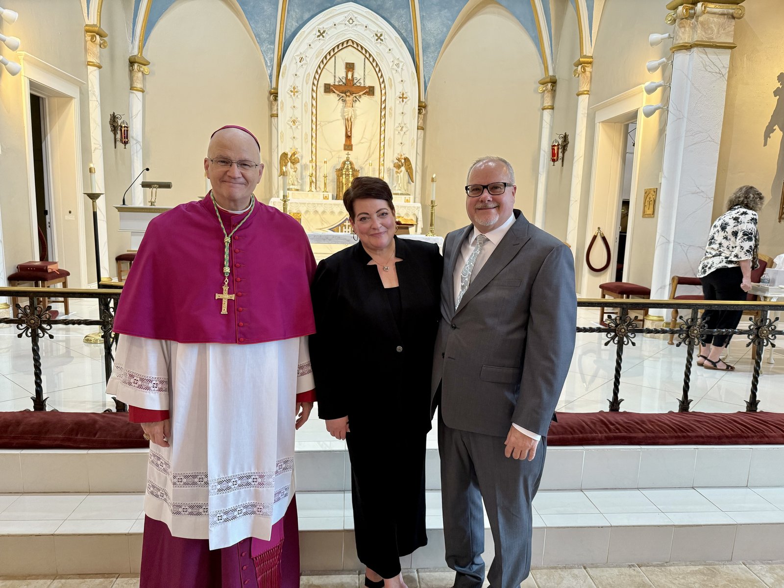 Archbishop Weisenburger with the proud parents of Anthony Nelson, the groom. Anthony’s mother, Christina Nelson, center, is the archbishop’s executive assistant.