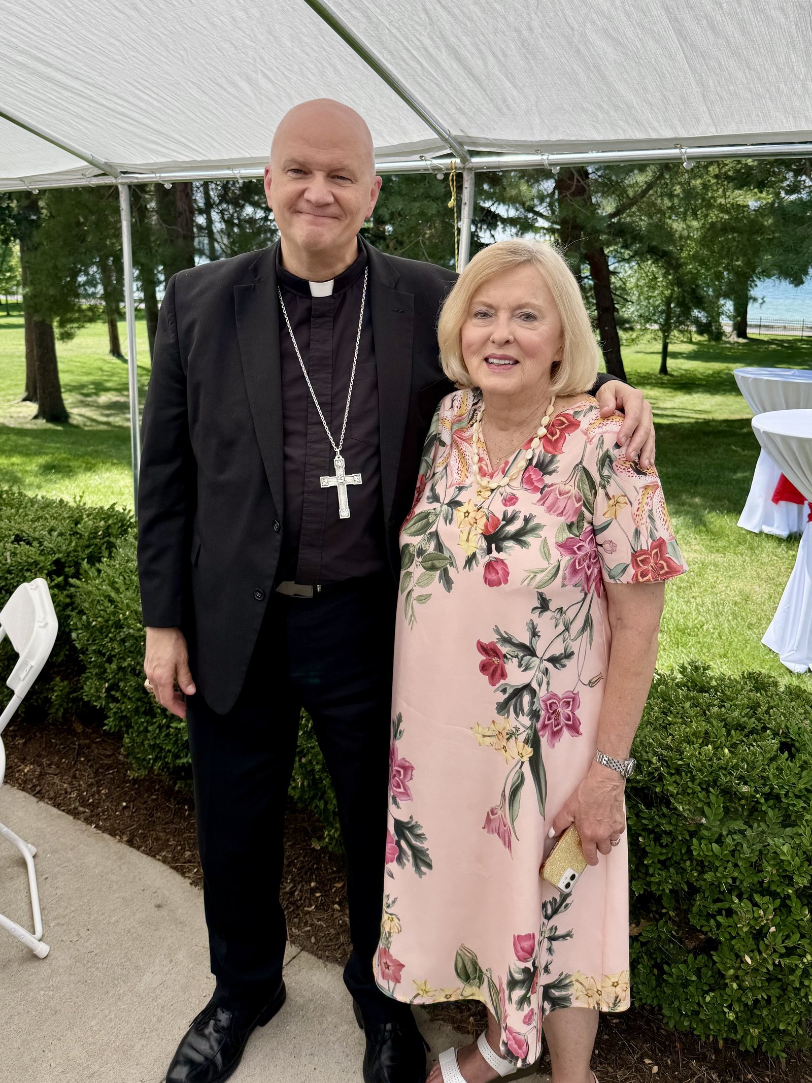 Archbishop Weisenburger is pictured with Patricia Krasinski Minor, a parishioner who attended the Aug. 10 Mass and altar blessing at the Chapel of Our Lady of Orchard Lake.