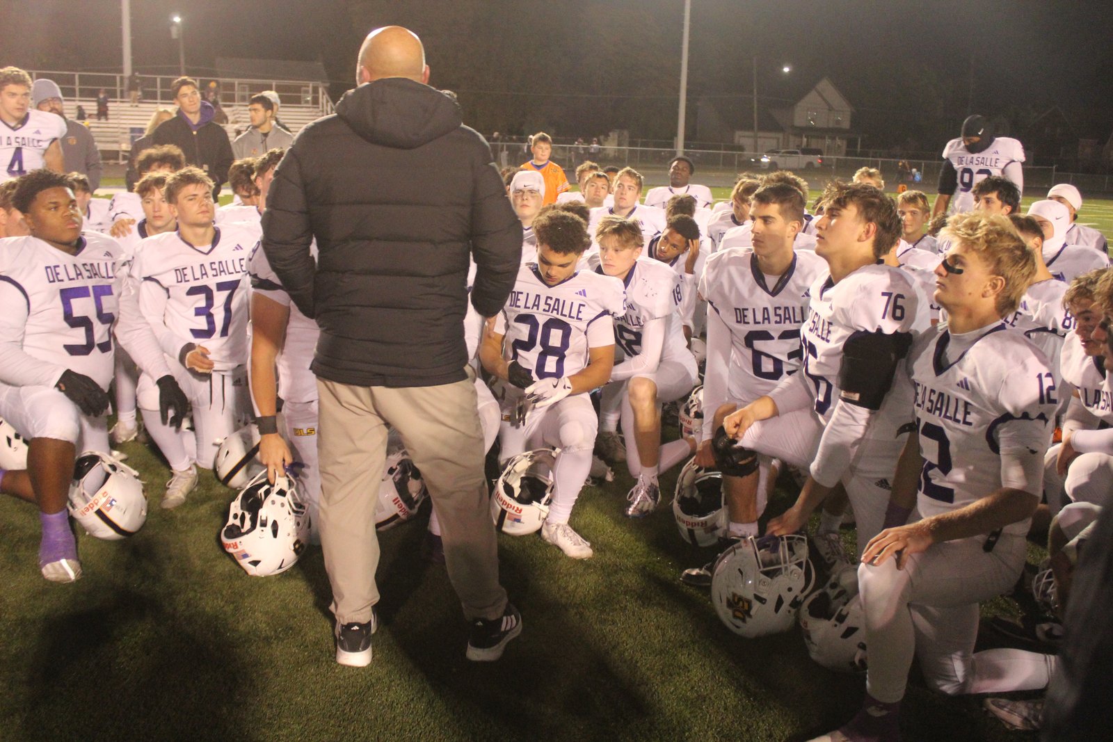 : Coach Dan Rohn addresses his Warren De La Salle football players following the Pilots’ 56-34 win Oct. 31 at Warren Fitzgerald. De La Salle next travels to face Port Huron in a Nov. 7 district final contest.