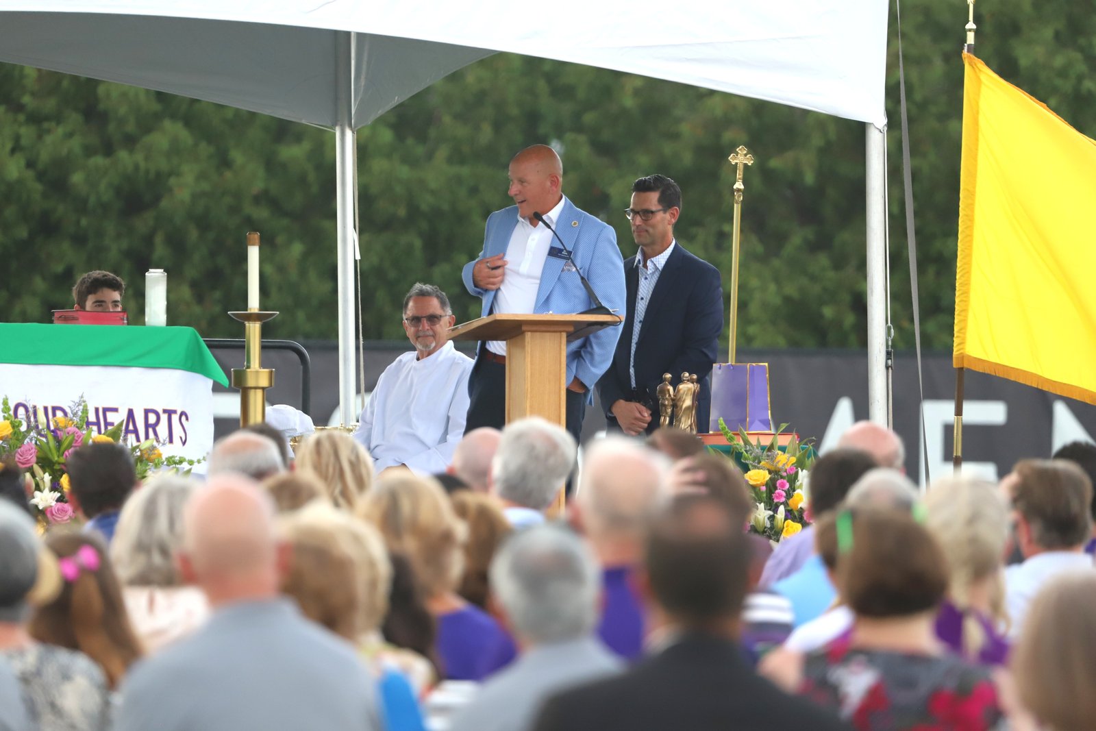 Dan Rohn, chief operating officer at De La Salle Collegiate, addresses those gathered at end of Mass.