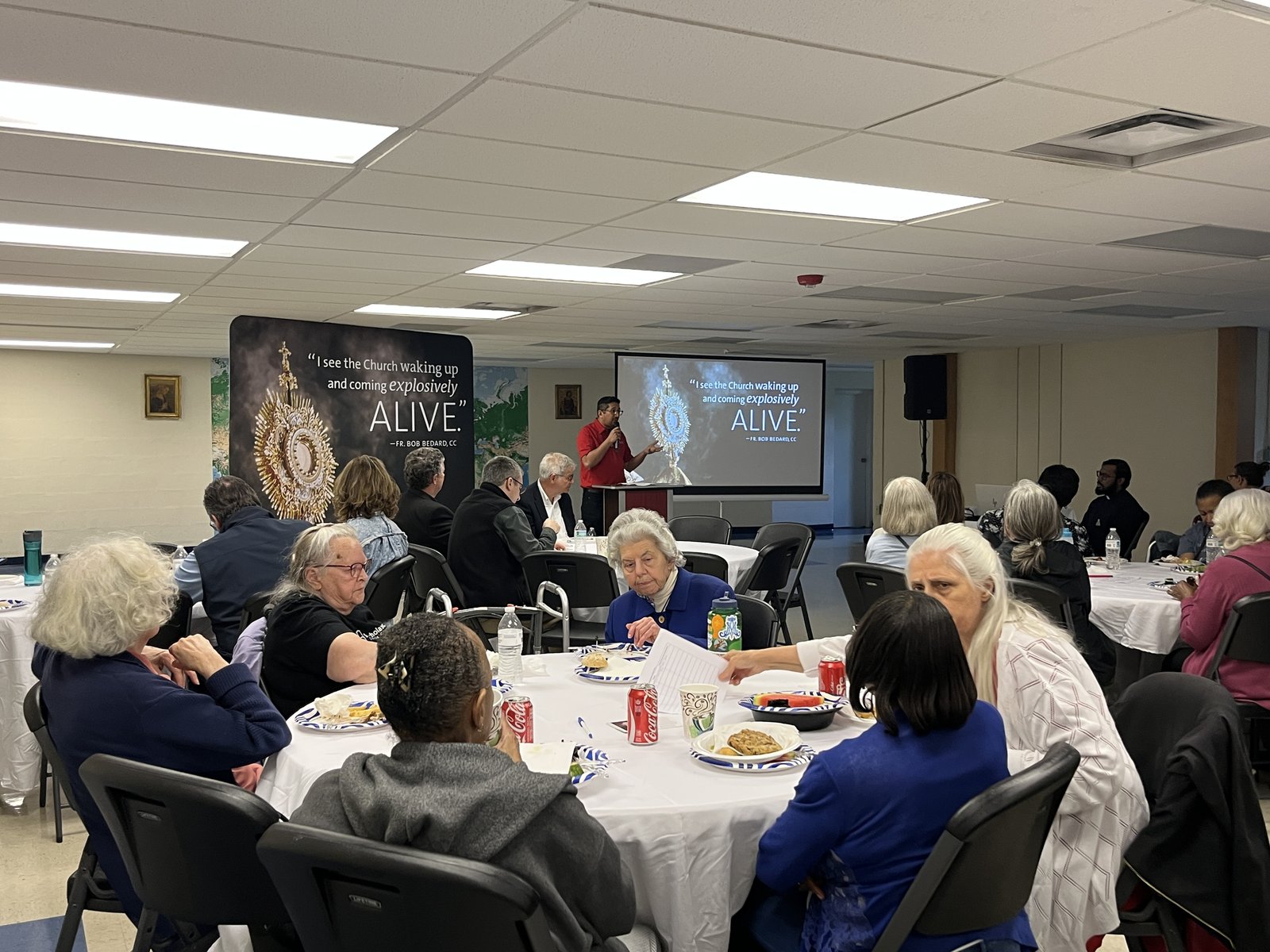Manas Khurana, a Companions seminarian who is on track be ordained a deacon this fall, addresses those gathered May 7 during the "Potluck and Praise" event at the Visitation House in Detroit. (Karla Dorweiler | Special to Detroit Catholic)