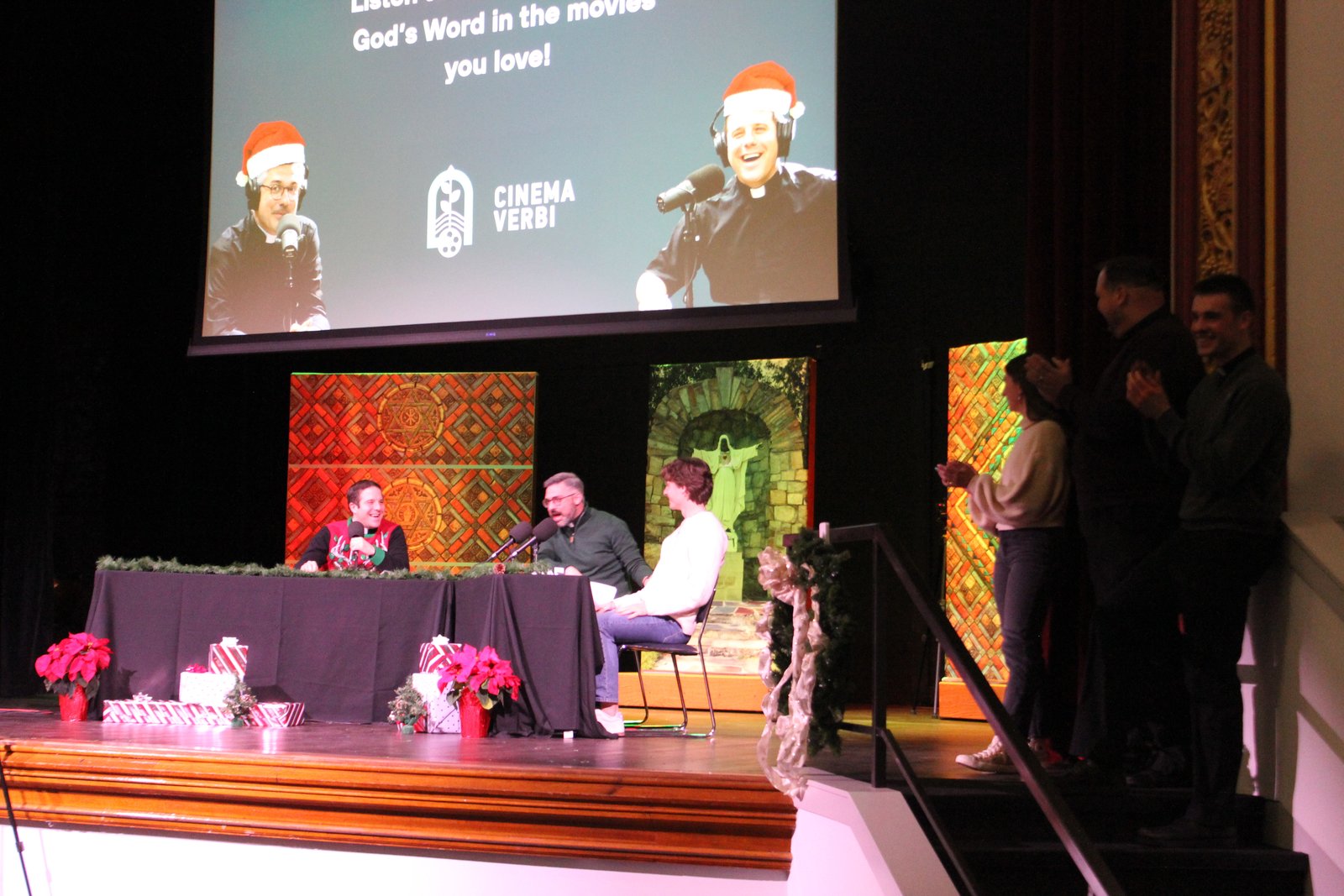 Fr. Meldrum and Fr. Hood quiz students during a trivia portion of the podcast Dec. 20 in Sacred Heart's newly renovated auditorium.