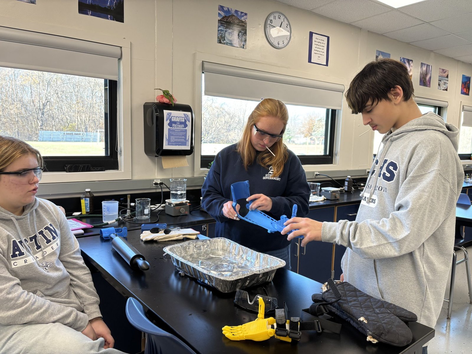 In order to become a certified e-NABLE chapter, Austin Catholic’s STEAM capstone class learned the process of 3D printing, thermoforming, building and stringing fully functioning prosthetic limbs through a series of badges. They submitted videos along the way demonstrating their functioning prosthetics for approval.