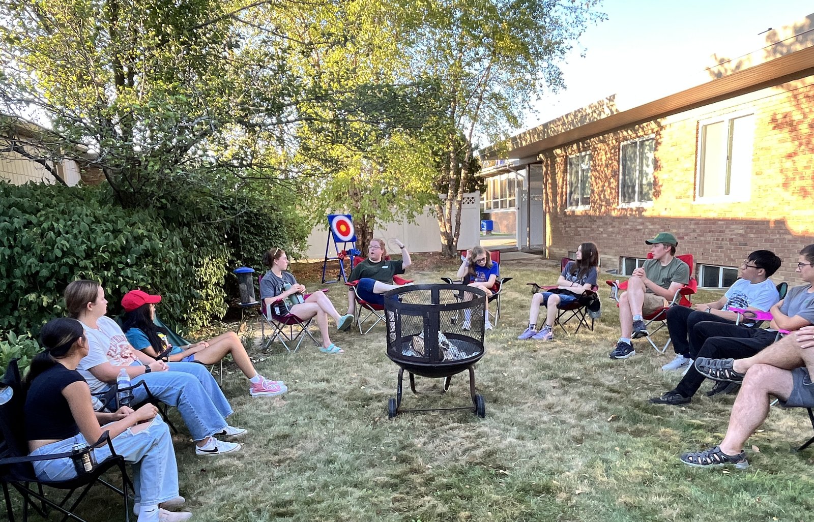 Following a Steubenville youth conference in June, teens from Our Lady of Sorrows Parish in Farmington gather for a bonfire at the parish. (Karla Dorweiler | Special to Detroit Catholic)