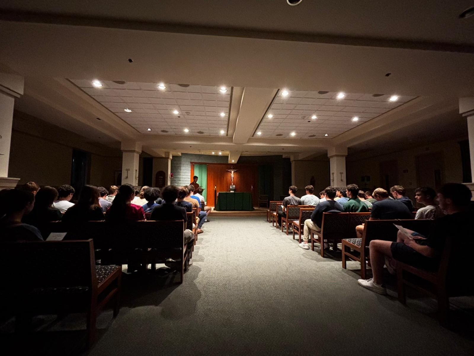 Students from two residence halls at the University of Notre Dame, Keough Hall and Grojean Hall, gathered last week in Keough Hall's chapel of Our Lady of Guadalupe for the first night of the Novena to the Sacred Heart of Jesus. All 34 residence halls were invited to pray the novena as a dorm community, in addition to the Litany of the Sacred Heart of Jesus and other prayer initiatives. (Courtesy of Luke Fisher)