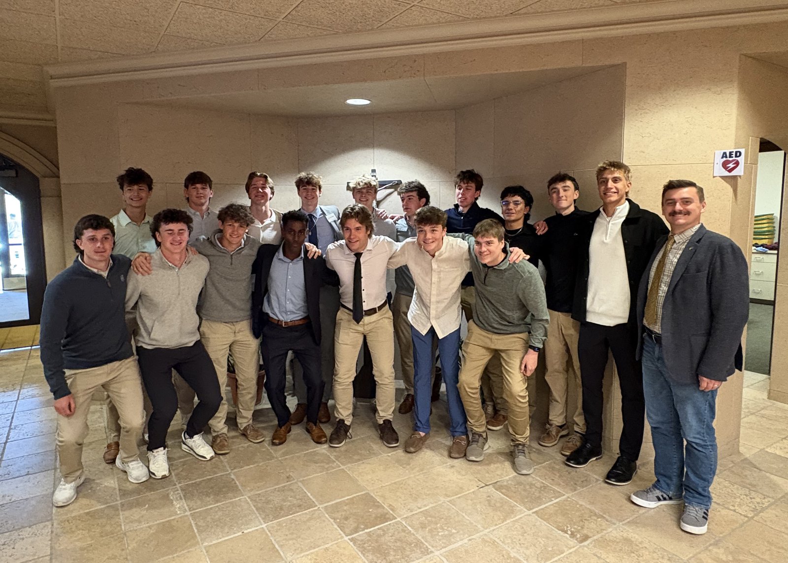 William Thibault poses with friends from Shrine Catholic High School after being initiated into the Catholic Church in April. Thibault says “the Shrine environment and my friends” moved him to become Catholic.