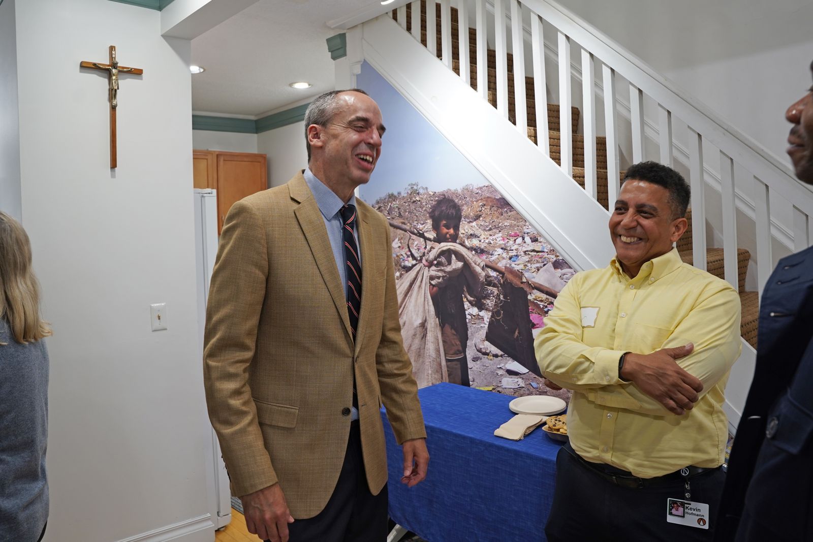 Michael Tenbusch, left, president of International Samaritan, meets with International Samaritan supporter Kevin Hofmann during the April 28 flag-raising ceremony at the organization's headquarters in Ann Arbor.