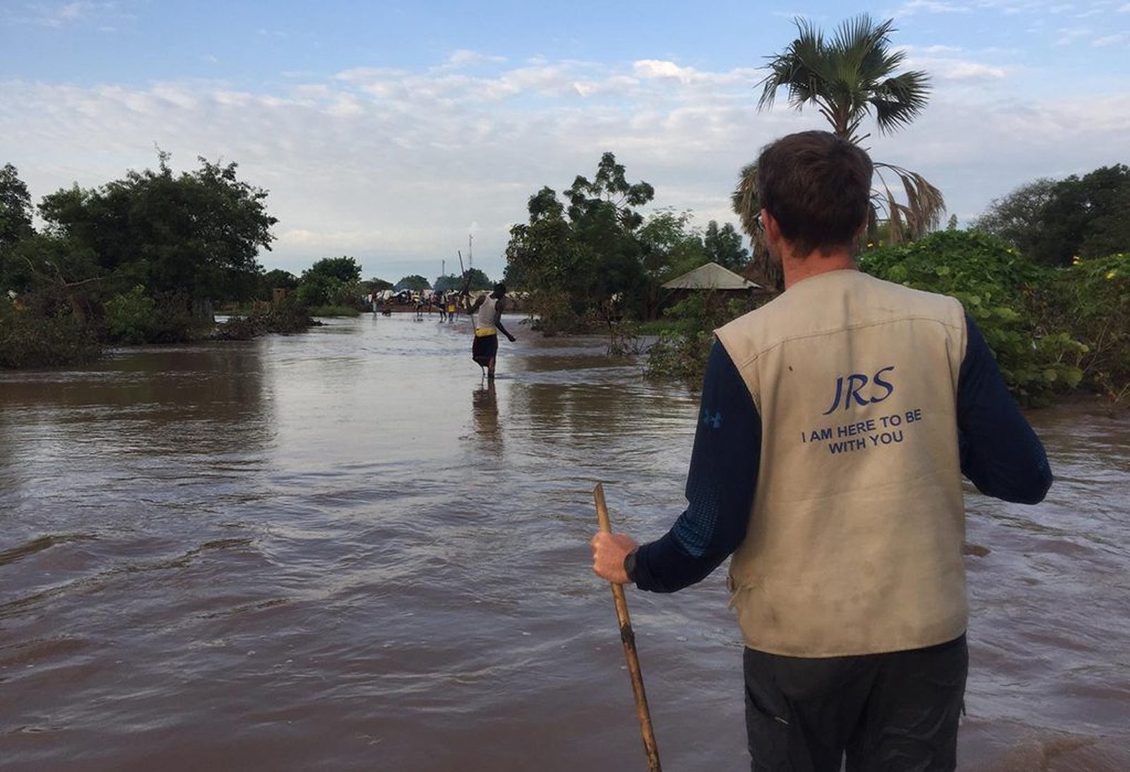 Fr. Ippel wades in the water in Maban, South Sudan, when unprecedented floods affected the region in late 2019 during his regency experience with Jesuit Refugee Service. (Photo courtesy of the Midwest Jesuits)