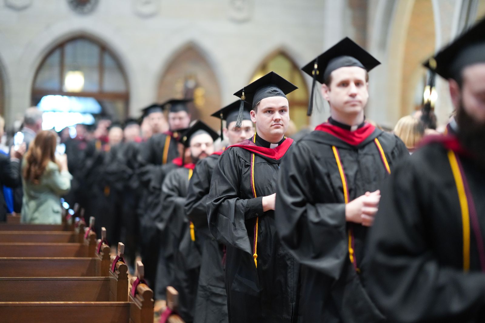 Graduates process into Sacred Heart Major Seminary's chapel May 3 during the commencement exercises and Baccalaureate Mass.