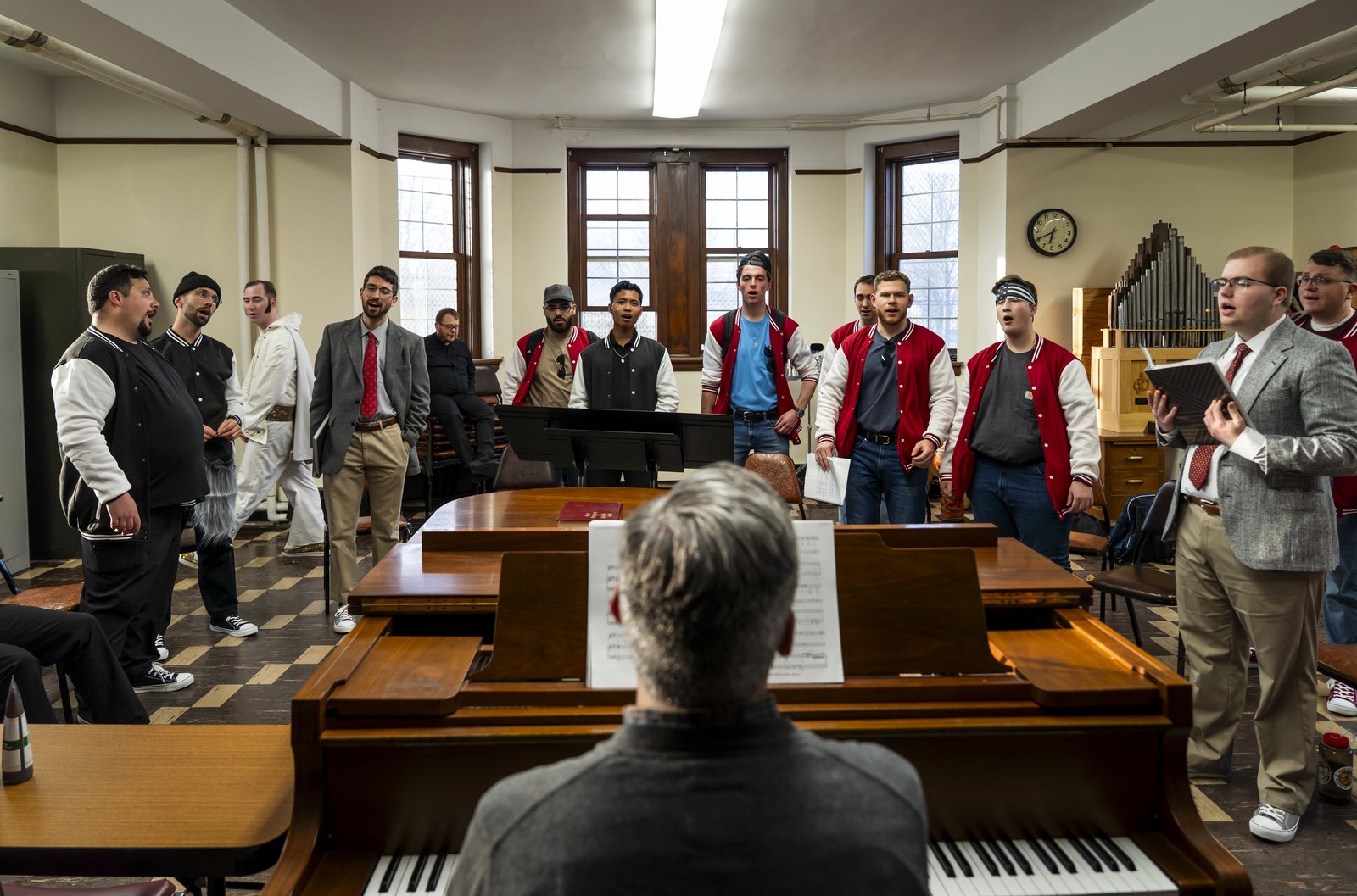 Sacred Heart Major Seminary faculty advisor, and Sacred Heart professor, Fr. Brian Meldrum, leads the seminarians in rehearsal in the buildup to their production of "Joseph and the Amazing Technicolor Dreamcoat." (Photo by Valaurian Waller | Special to Detroit Catholic)