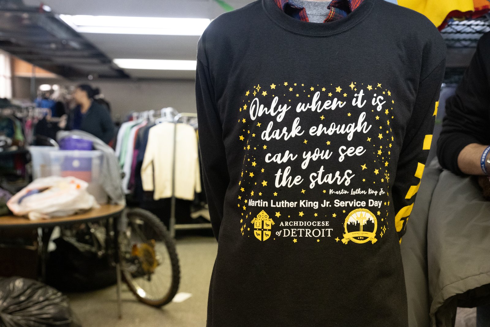Shirts worn by young people participating in the Martin Luther King Jr. Day of Service include a quote from King: "Only when it is dark enough can you see the stars." (Steven Stechschulte | Special to Detroit Catholic)