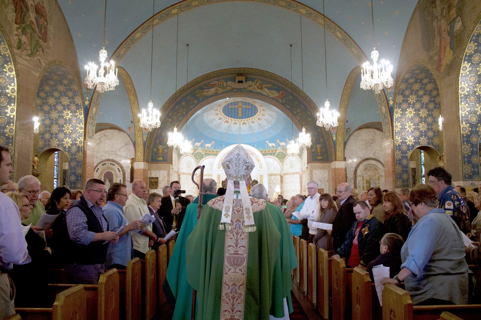 Auxiliary Bishop Donald F. Hanchon processes into Transfiguration Church in Detroit, part of St. John Paul II Parish, during Mass Mob XVII on Oct. 11, 2015. (Annie Schunior | Detroit Catholic file photo)