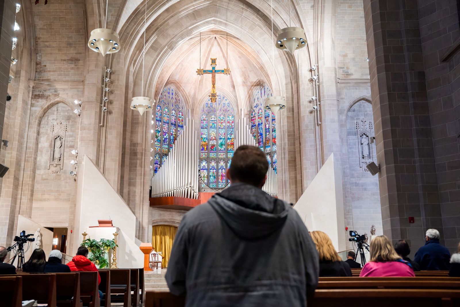 A man gazes up to the expansive stained-glass windows of the Cathedral of the Most Blessed Sacrament during the Mass for the Protection of the Unborn on Jan. 23.