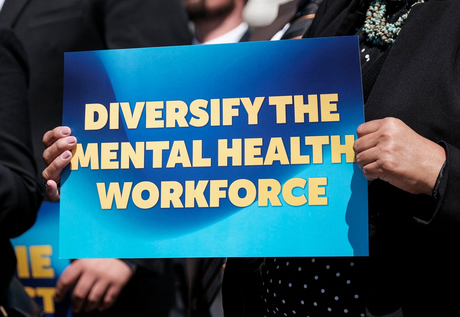 A mental health advocate holds a sign during a press conference on the proposed Mental Health Workforce Act April 10, 2024, on Capitol Hill in Washington. The nation's Catholic bishops on Sept. 15, 2025, launched new component of their National Catholic Mental Health Campaign, "Healing and Hope." (OSV News photo/Michael A. McCoy, Reuters)