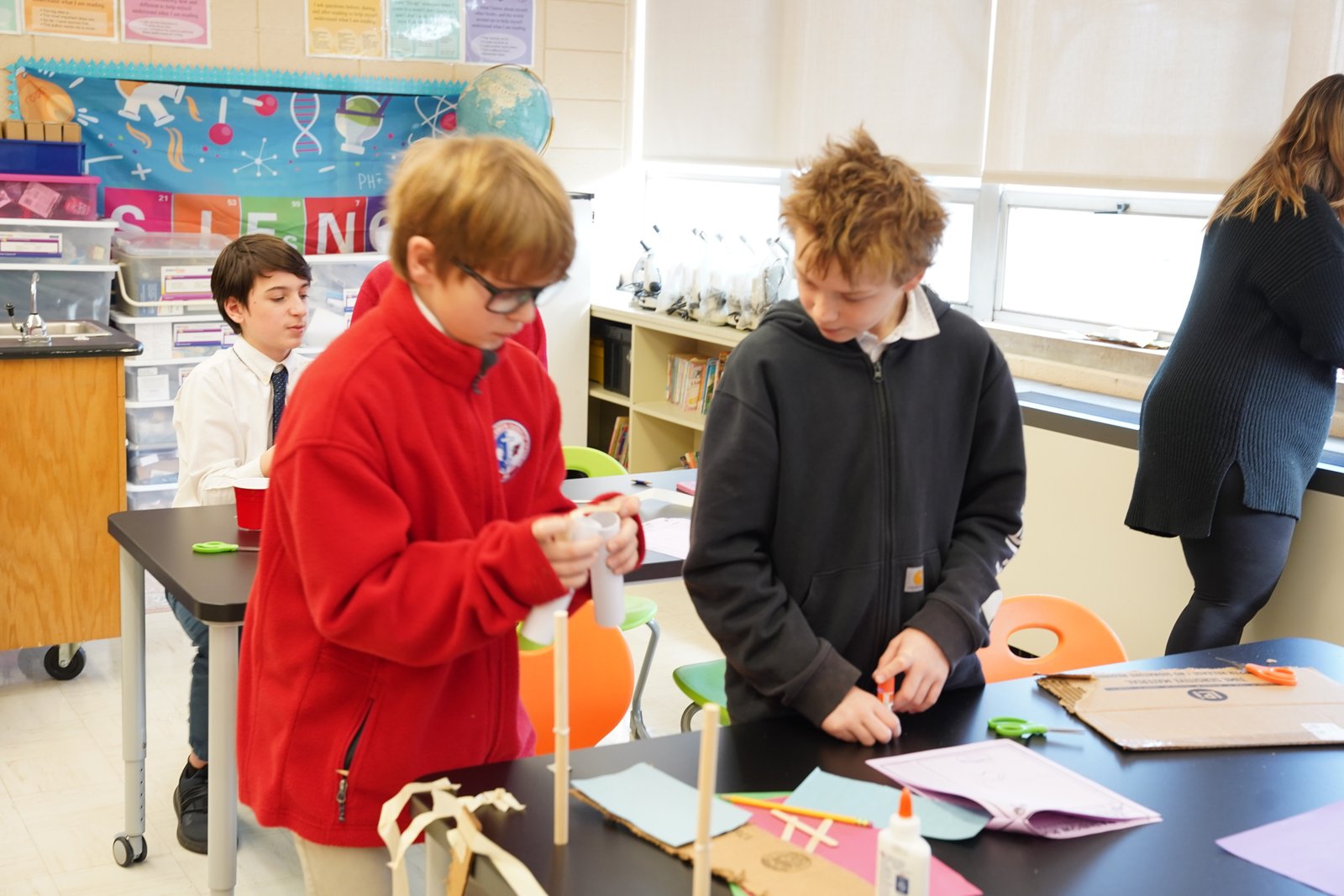 Fifth- and sixth-graders in teacher Madeline Potter's STEM class complete a class project. In microschools, students from different grade levels work side by side.