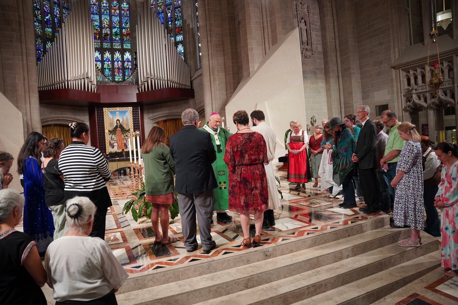 Archbishop Weisenburger blesses members of Strangers No Longer who are set to depart for a bi-national gathering of immigration advocates at the Arizona-Mexico border.
