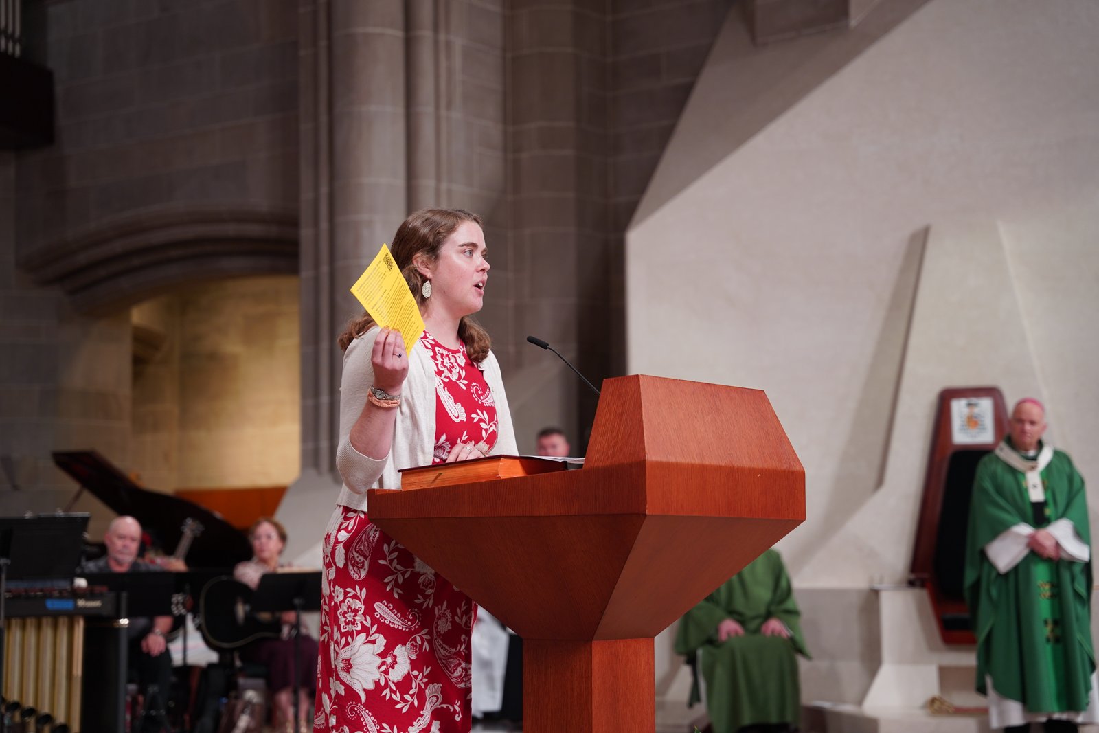 Amy Ketner speaks after Mass about Strangers No Longer and how people can get involved in the organization.