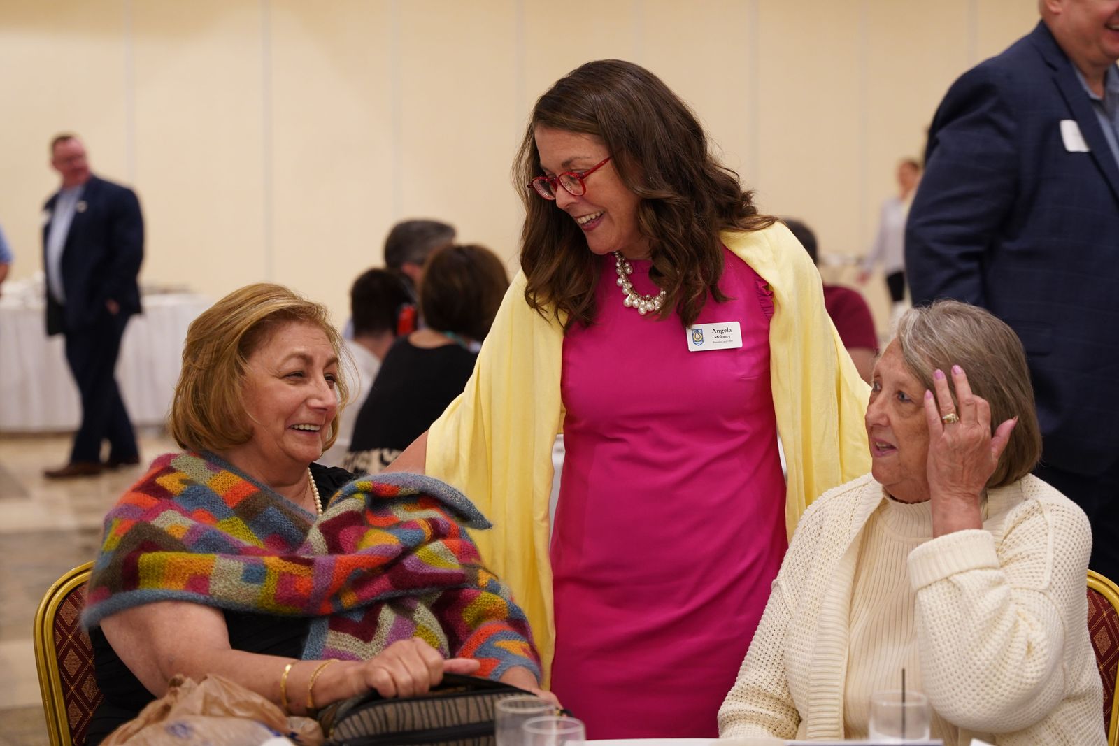 Catholic Foundation of Michigan president and CEO Angela Moloney, center, talks with benefactors during the July 19 event. Moloney said the St. Margaret of Castello Granting Fund seeks to allow Catholic schools to overcome the twin obstacles of funding and expertise as it provides tools to allow schools to better serve students with special needs. (Daniel Meloy | Detroit Catholic)