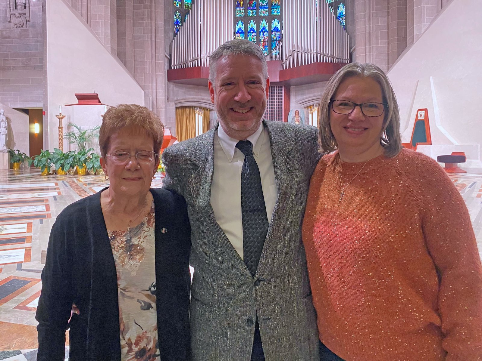 Virginia Rose Monforton, Bishop Monforton's mother, with Dan Monforton, Bishop Monforton's brother, and his wife, Jen Monforton at the Cathedral of the Most Blessed Sacrament in Detroit on Nov. 7, where Bishop Monforton was named Detroit's 32nd auxiliary bishop. (Photo by Daniel Meloy | Detroit Catholic)