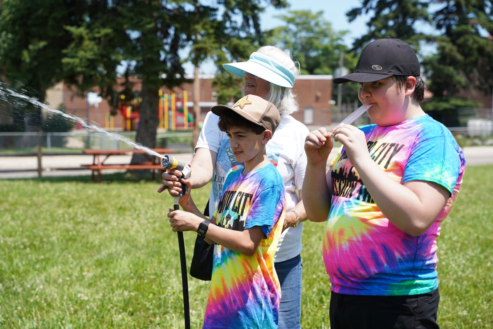 Motor City Missionaries water a garden and enjoy some popsicles on Detroit's east side on June 24. The mission served in Detroit, Flint and Royal Oak, June 24-26.