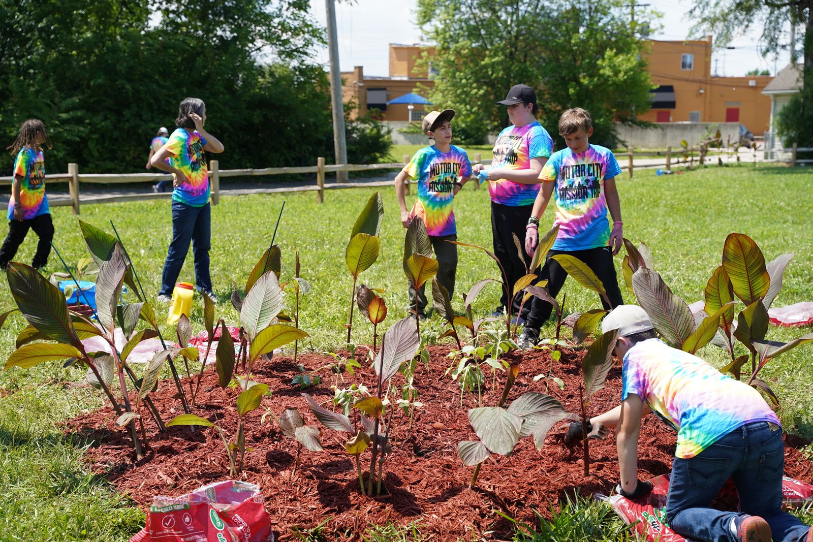 Motor City Missionaries work on a garden in lot next to the Detroit Catholic Pastoral Alliance properties on McClellan Street on Detroit's east side.