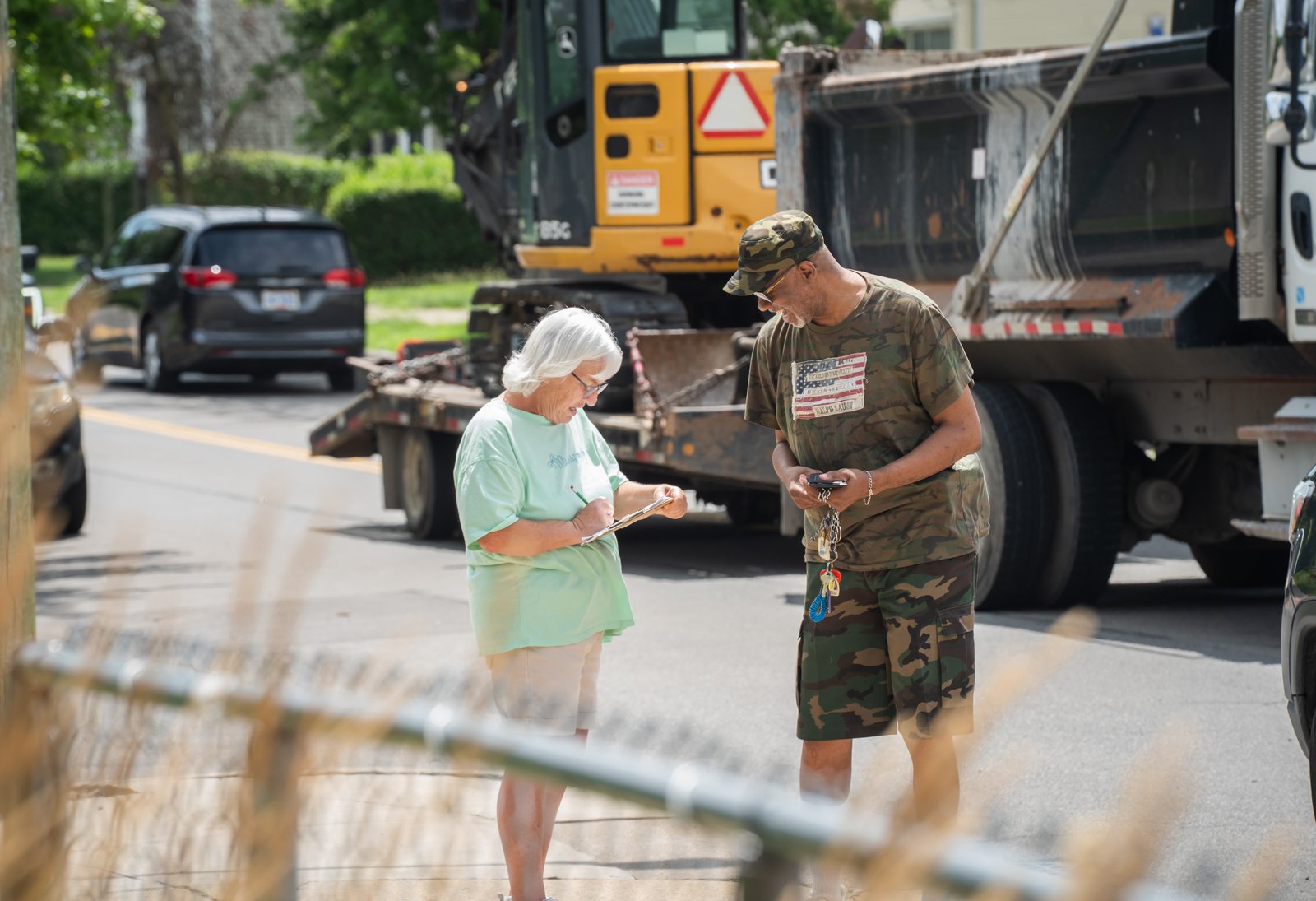 Anne Crowe, parish secretary and outreach coordinator, converses with a guest of the Nativity of Our Lord Parish food bank. Families can come to the food bank once a month to pick up essential food items.