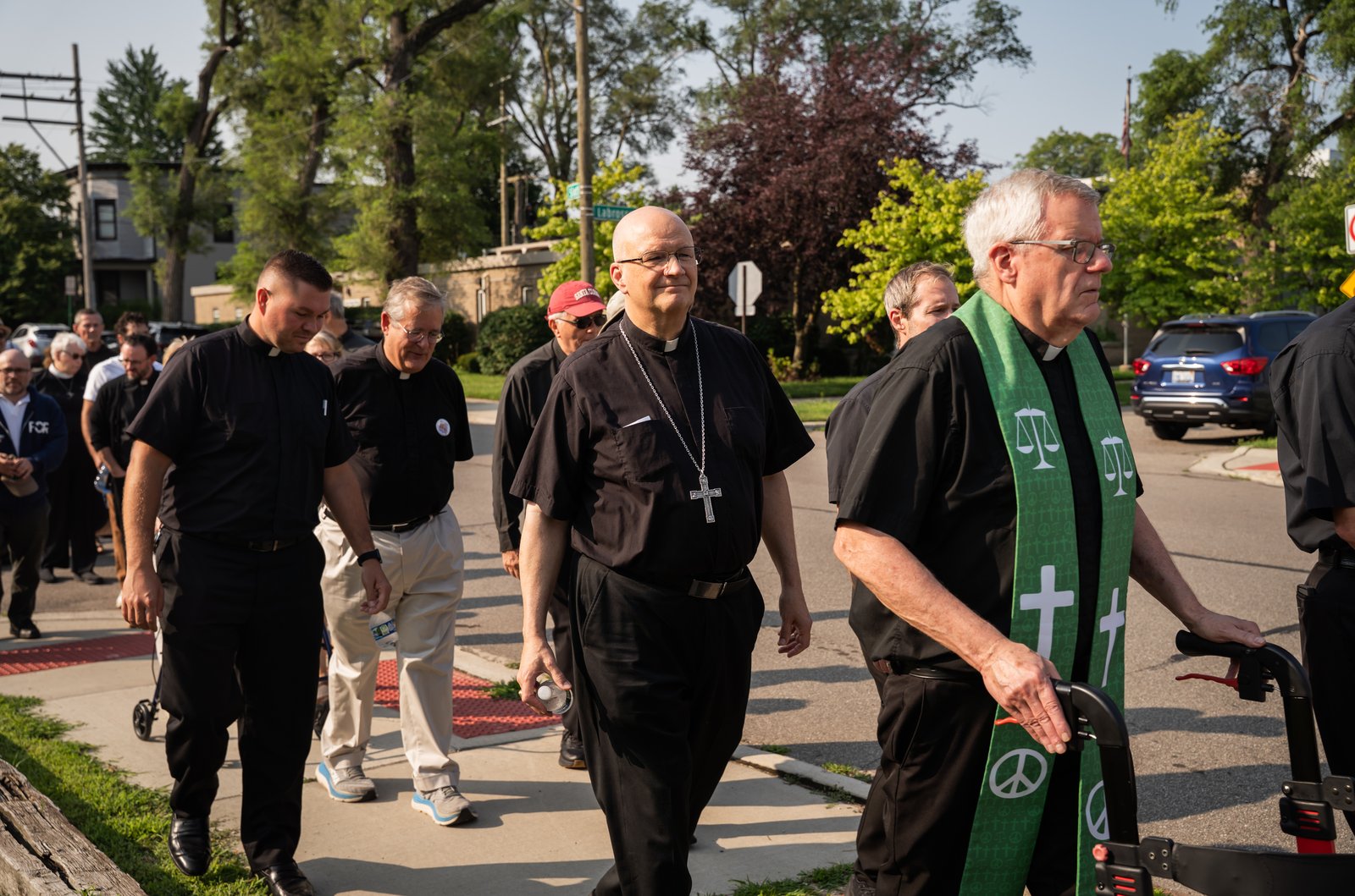 Archbishop Edward J. Weisenburger joins other Detroit clergy during a procession from Most Holy Trinity Parish in Corktown to the ICE Regional Field Office on Michigan Avenue in downtown Detroit on July 14. The procession was organized by Strangers No Longer, a Catholic grassroots immigrant rights advocacy group.