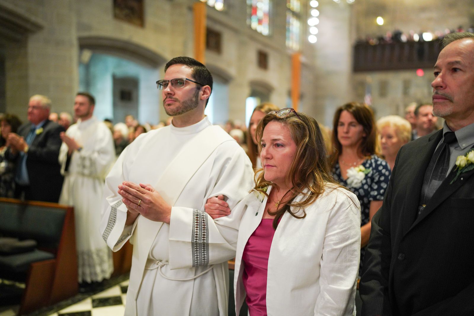 Fr. Jeremy Schupbach stands next to his mother at the start of the Rite of Ordination to the Priesthood at the Cathedral of the Most Blessed Sacrament on May 27. Fr. Schupbach delivered the ordination class’s message of thanksgiving follow Mass, thanking the archbishop, priests, teachers, pastors, parents and family who supported the five newly ordained priests on their journey toward ordination.