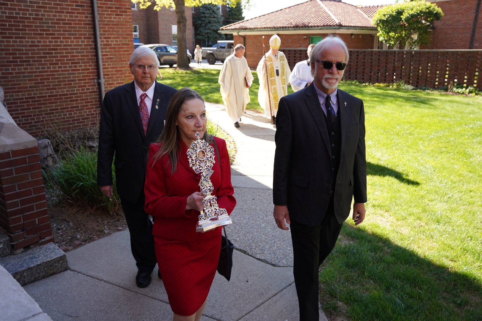 Judi Kadela, business manager and pastoral associate for St. Barbara Parish, carries the first-class relic of St. Padre Pio into St. Barbara Parish at the beginning of Mass. Since St. Barbara Parish hosted an event with first- and second-class relics of St. Pio in November 2023, devotion to the Italian Capuchin saint has grown strong.
