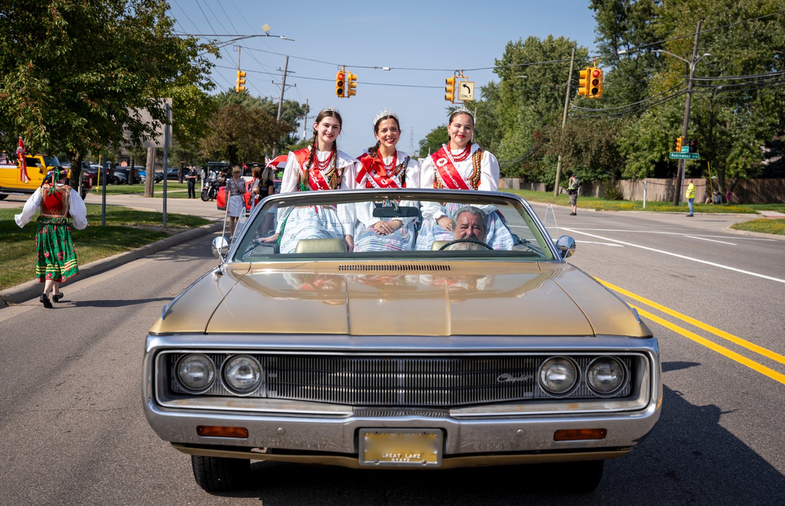 The American Polish Century Heritage Queen court rides in the Polish Day Parade. Since 1961, the American Polish Century Club has promoted Polish customs and festivals in the community.